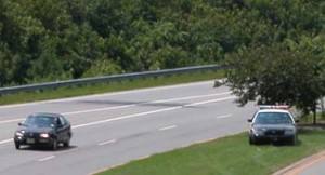 Police car hiding in a speed trap.