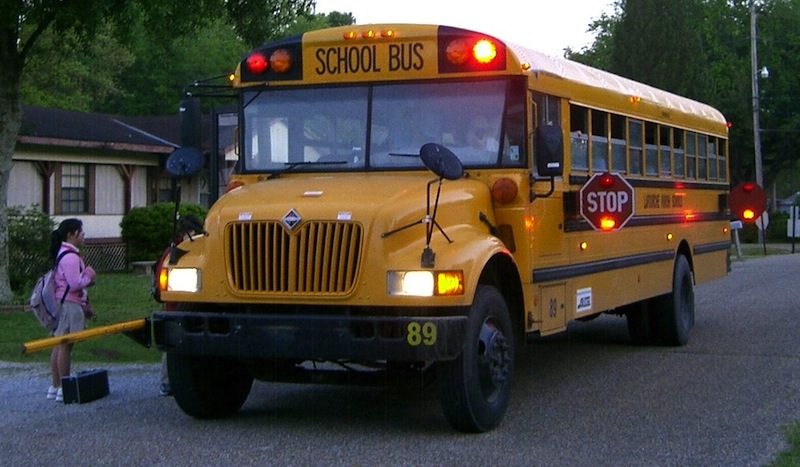 Passing a stopped school bus can land you a ticket for $400 plus five points for a first offense. Photo courtesy Wikimedia Commons. 